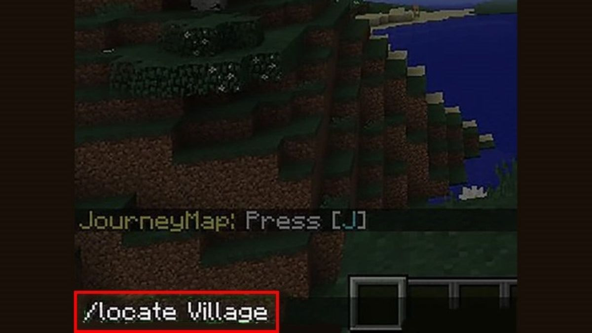 Khung chat trong Minecraft trên máy tính hiển thị lệnh '/locate village' đã nhập, cùng với tọa độ của ngôi làng gần nhất.